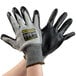 A pair of Cordova Monarch gray and black heavy duty work gloves with HCT nitrile palm coating.