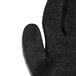 A close up of a Cordova gray and black warehouse glove with a black latex crinkle palm coating.