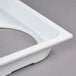 A white rectangular lid with 4 holes on it.