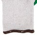 A white knitted glove with a green latex palm coating.