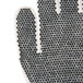 A close-up of a Cordova warehouse glove with black PVC dots on white fabric.