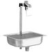 A Fisher stainless steel pedestal glass filler on a metal sink with a metal drain.