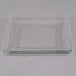 A close-up of a Libbey square glass salad plate with a clear edge.