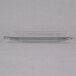 A clear glass Libbey square salad plate on a white surface.