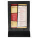 A Menu board with a black frame holding a menu.