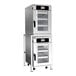A stacked electric oven package with two stainless steel units, each featuring a glass door and digital control panel, designed for commercial kitchen use.
