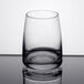 A close-up of a Stolzle juice glass with a rim.