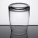 A Stolzle juice glass on a table.