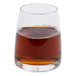 A Stolzle juice glass filled with brown liquid.