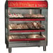 An Alto-Shaam heated countertop display case with food on it.