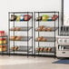 A Regency slanted wire shelf rack with food on it in a bakery.