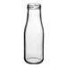 An Acopa clear glass milk bottle with a black cap.