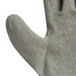 A close up of a gray Cordova Cor-Grip glove with a gray crinkle latex palm coating.