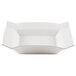 A close-up of a CAC Times Square bright white square china soup plate with curved edges.
