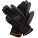 A pair of black Cordova nylon gloves with black polyurethane palms.