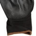 A black and brown Cordova warehouse glove.