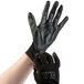 A pair of Cordova black nylon gloves with black polyurethane palm coating.