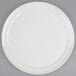 An American Metalcraft white ceramic pizza serving tray with a round rim.