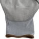 A close up of a Cordova gray warehouse glove with gray polyurethane palm coating.