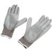 A pair of grey Cordova Cor-Touch Lite gloves with gray polyurethane palms and white trim.