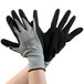 A pair of Cordova gray nylon gloves with black foam nitrile palms on a white background.