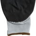 A pair of grey and black Cordova nylon gloves with black foam nitrile palms.