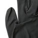 A close up of a large gray Cordova Cor-Touch foam glove with black foam nitrile coating on the palm.