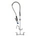 A Fisher stainless steel wall mounted pre-rinse faucet with a hose.