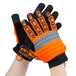 A close-up of a pair of Cordova Hi-Vis orange and black warehouse gloves with TPR protectors.