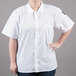 A woman wearing a white Chef Revival cook shirt.