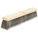 A close-up of a Carlisle 24" push broom head with gray flagged bristles.