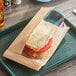 A Bagcraft Dubl View Kraft sandwich bag on a tray.