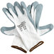 A pair of Cordova white nylon gloves with gray foam nitrile palm coating on a white background.