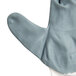 A close up of a Cordova Cor-Touch Foam II glove with white trim on a white surface.