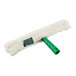 A white fluffy mop with a green plastic T-bar handle.