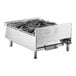 A stainless steel Garland countertop range with 4 burners.