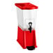 A red and clear slim beverage or juice dispenser with a spigot and drip tray.