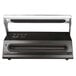 A black and silver Weston Professional Advantage vacuum packaging machine on a counter.