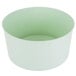 A white plastic container with a green rim.