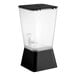 A 5-gallon black beverage or juice dispenser with a clear container and black base.