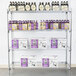 A Metro chrome wire shelving unit with boxes and bottles on the shelves.