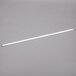 An Avantco T8 fluorescent light bulb with a white tube on a gray background.