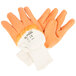 A pair of orange Cordova Ruffian warehouse gloves with white jersey lining.