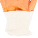 A pair of Cordova Ruffian orange crinkle latex gloves with white jersey lining.