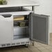 A Beverage-Air stainless steel undercounter refrigerator with a door open.