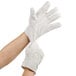 A person wearing Cordova heavy weight white work gloves with burlap lining.