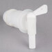 A white plastic faucet with a handle on a white vented container.