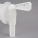 A white plastic Impact vented dispensing container faucet.