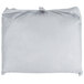A white ironing board cover with a silver pocket.