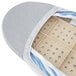 A grey silicone-coated ironing board cover with a storage pocket.
